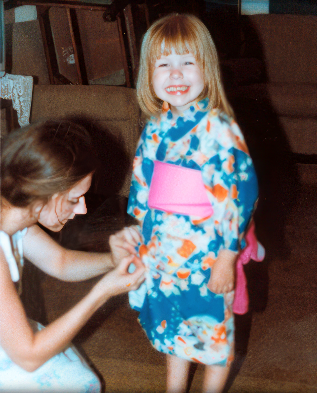 Christina's mom fixing her Japanese Yukata so that she can go to the local Japanese summer fair. Age 3 1/2.
Christina's mom fixing her Japanese Yukata so that she can go to the local Japanese summer fair. Age 3 1/2.