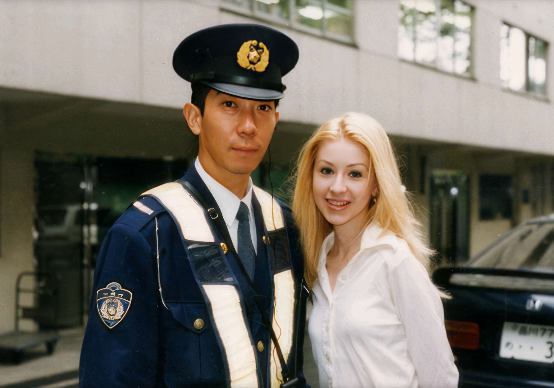 Christina, age 15, with a Japanese policeman.
