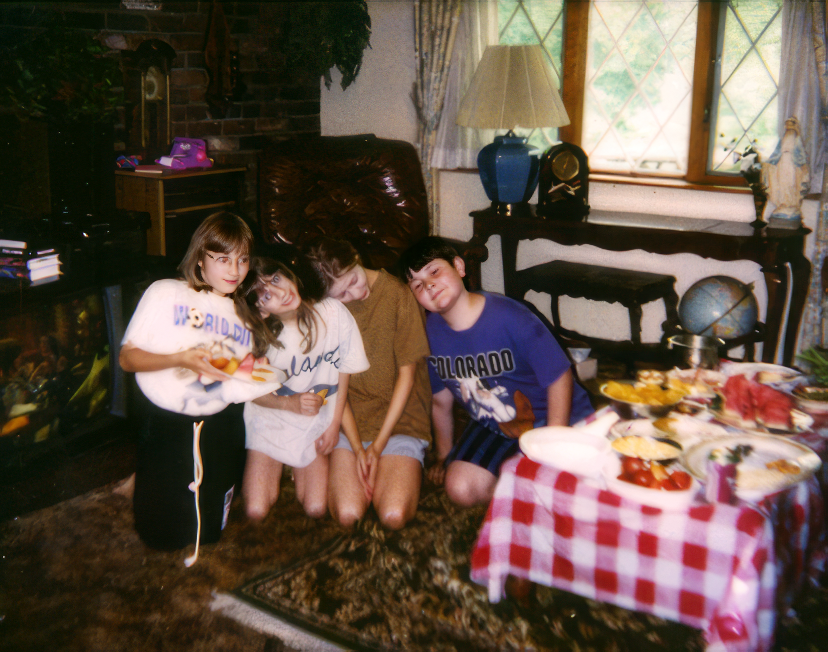 Christina, age 14, with her sister Rachel, stepsister Stephanie, and stepbrother Casey.
