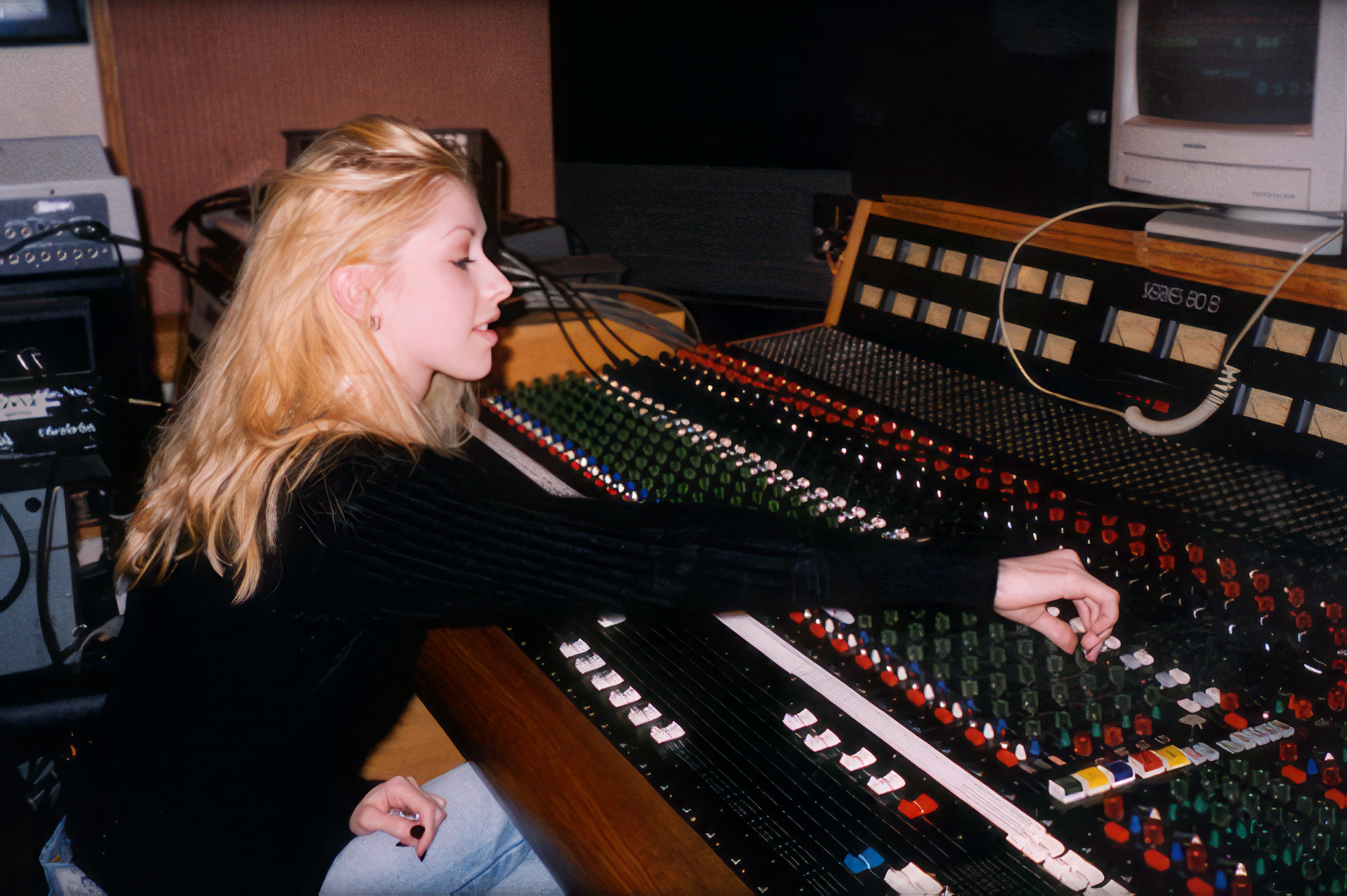 Christina, trying her hand at the soundboard in the recording studio.
