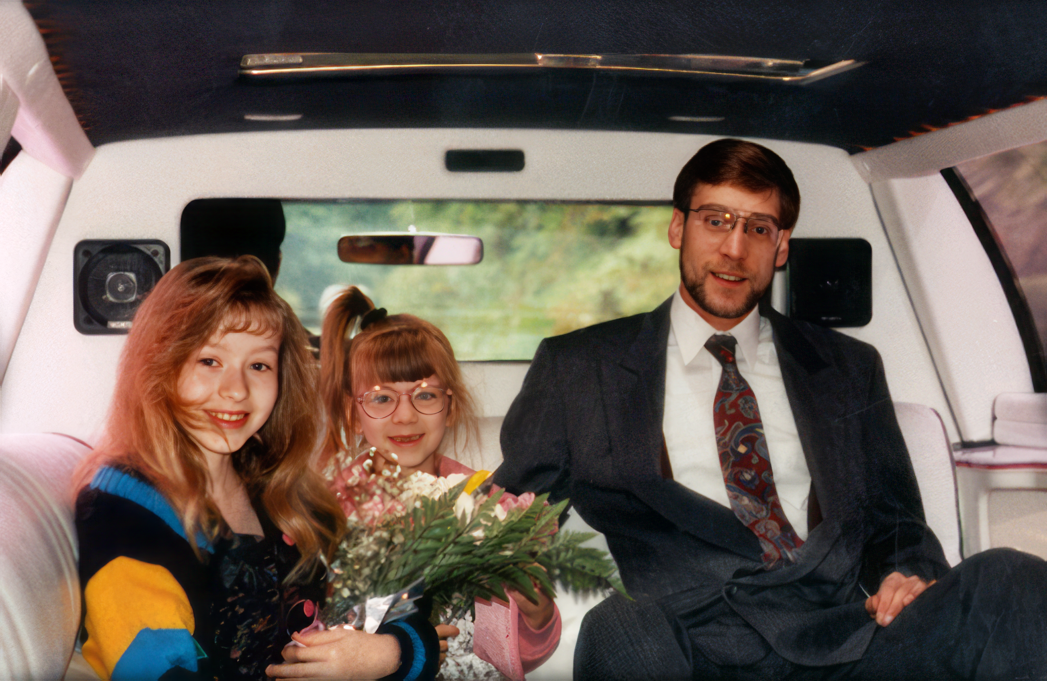 Christina, age 11, her step father Jim, and sister Rachel in a limo going to the grand opening ceremonies of the new international Pittsburgh Airport in 1992.
