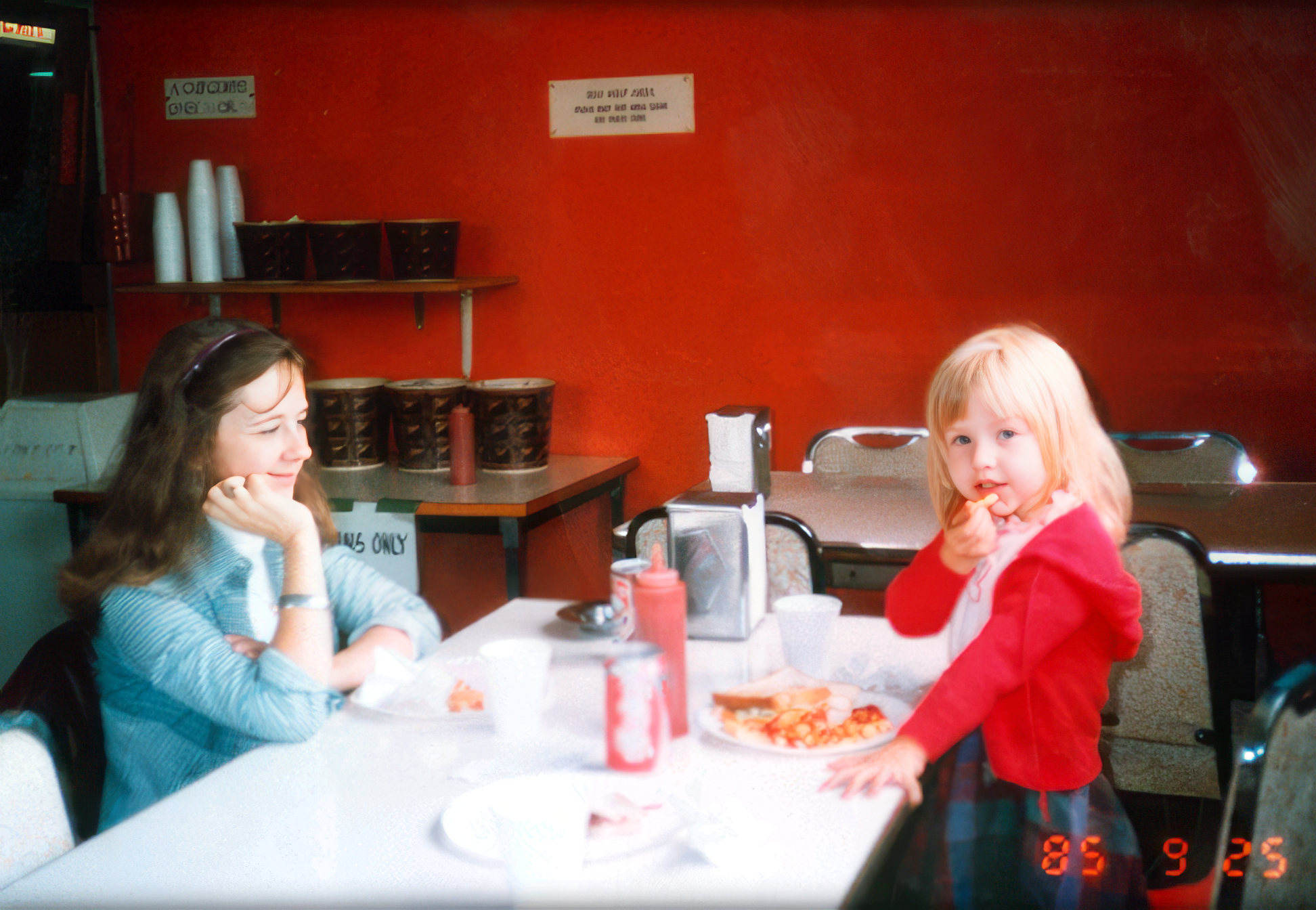 Christina and her mother enjoying pizza.
Christina and her mother enjoying pizza.