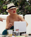 Christina_Aguilera_and_Kim_Kardashian_lounge_by_the_pool_for_a_friends_bachelor_party_at_the_Fountainebleau_in_Miami_-_June_12_-_Christina_Aguilera_Daily_00036.jpg