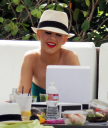 Christina_Aguilera_and_Kim_Kardashian_lounge_by_the_pool_for_a_friends_bachelor_party_at_the_Fountainebleau_in_Miami_-_June_12_-_Christina_Aguilera_Daily_00070.jpg